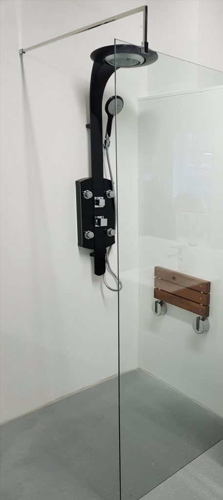 image a electric shower and foldable seating for a shower room